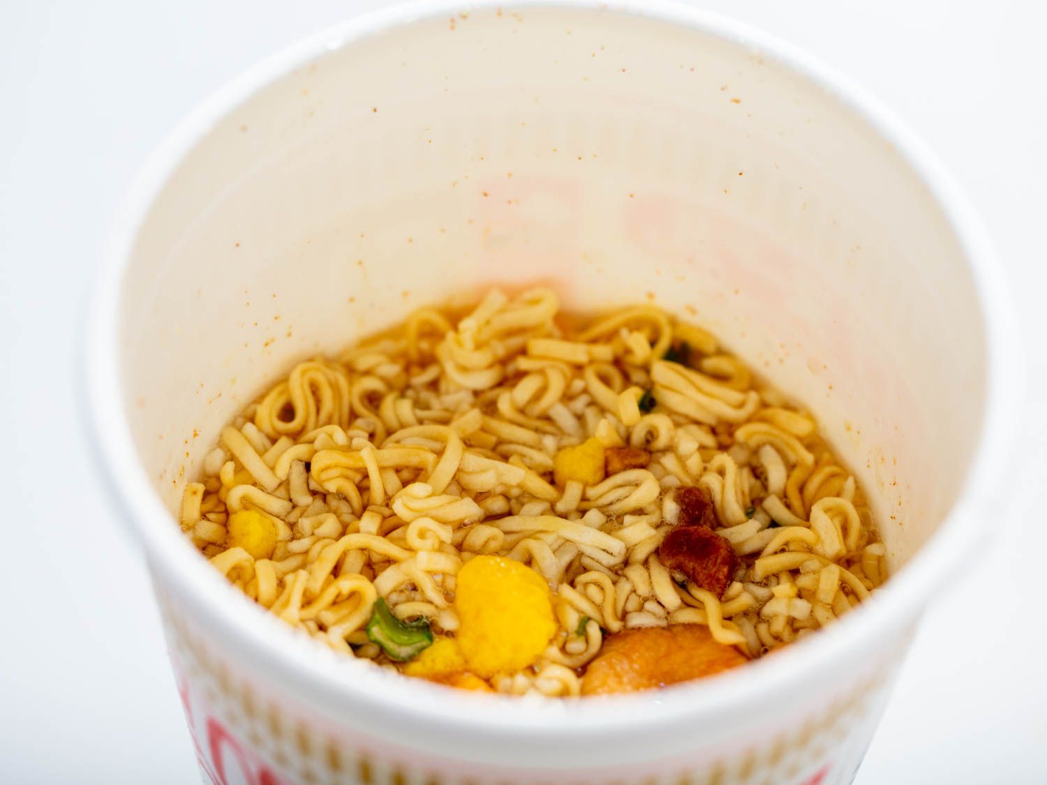 Close-up of the crushed noodles, submerged in boiling water.