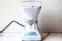 Snowie Little Snowie Max Snow Cone Machine on a kitchen counter