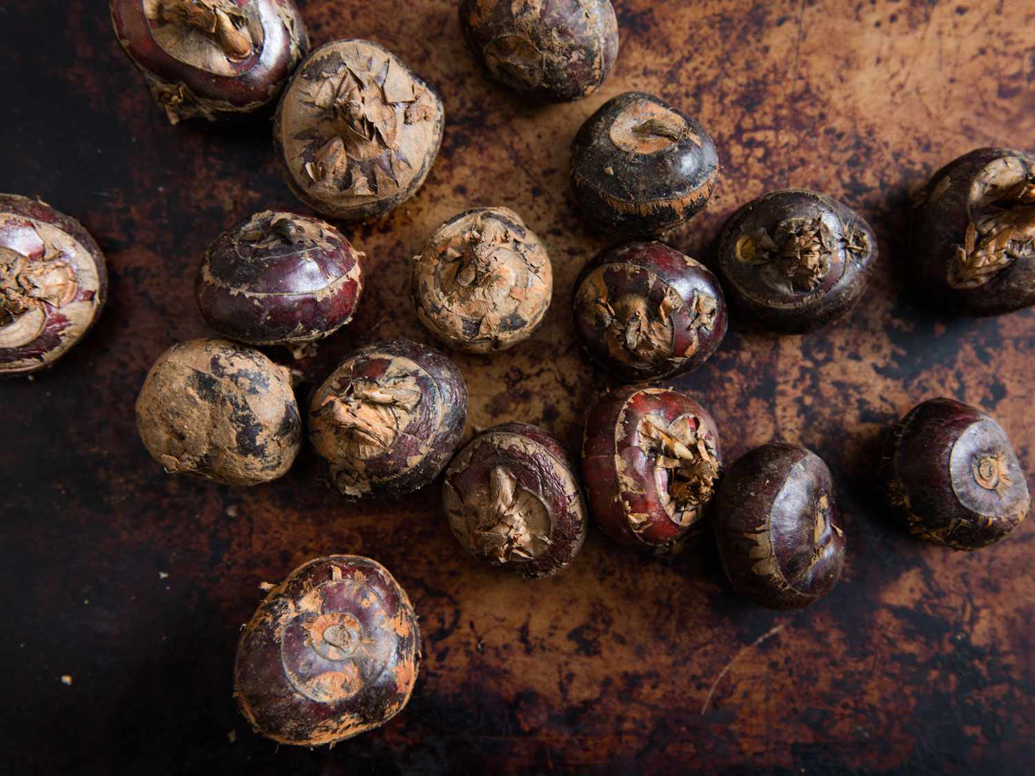 fresh water chestnuts on a cutting board