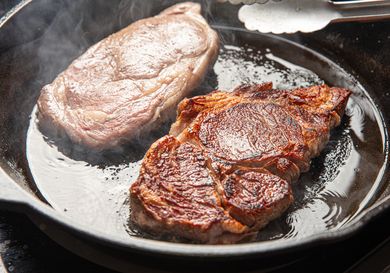Two steaks in a cast iron pan
