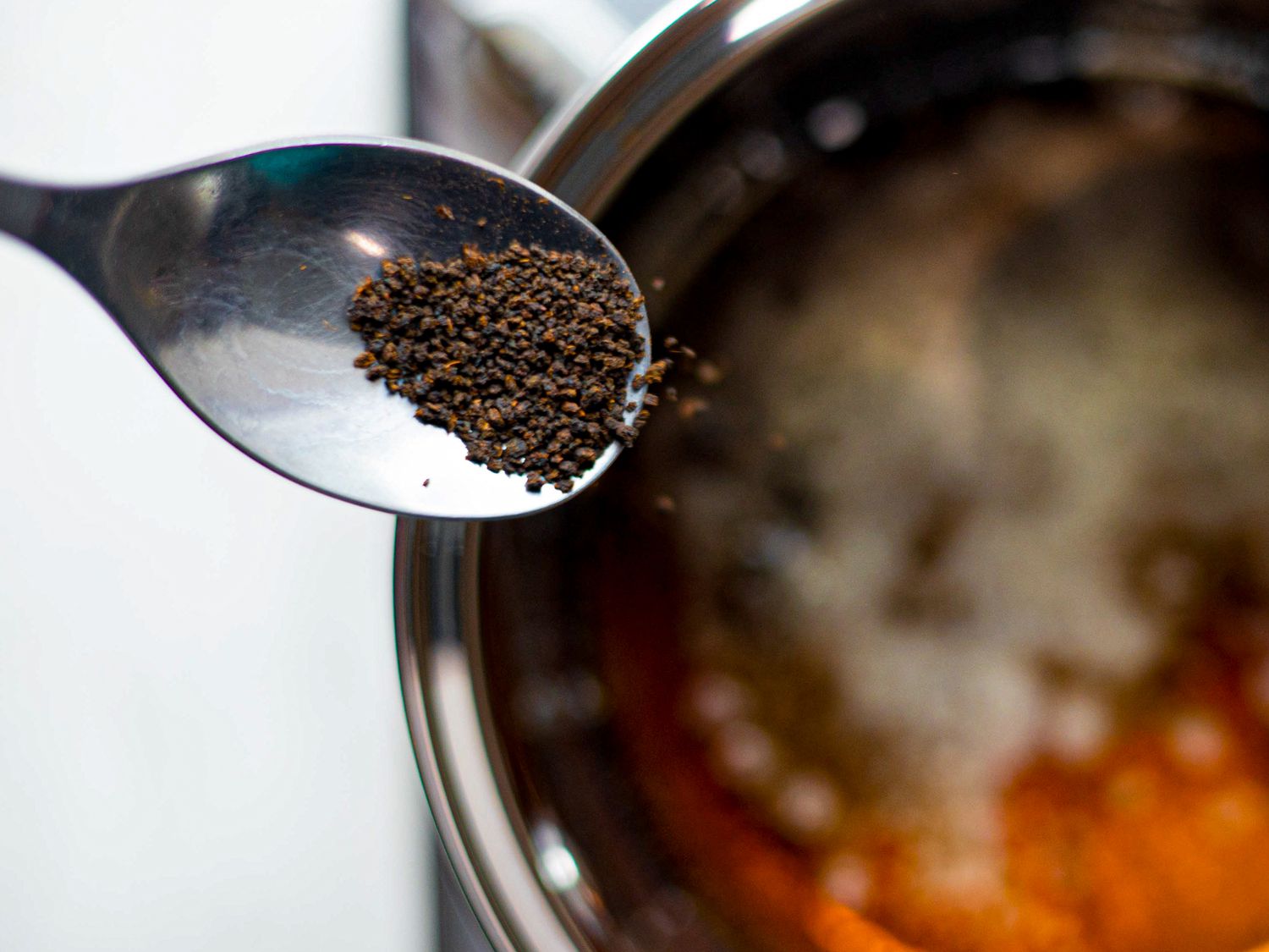 Tea bring dropped into pot