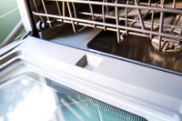 The detergent well of the Hermitlux countertop dishwasher.