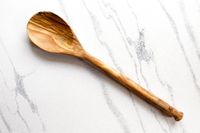 Sabatier All-Purpose Spoon resting on a marbled surface