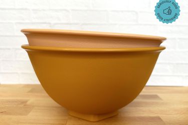 Two stacked mixing bowls on a countertop