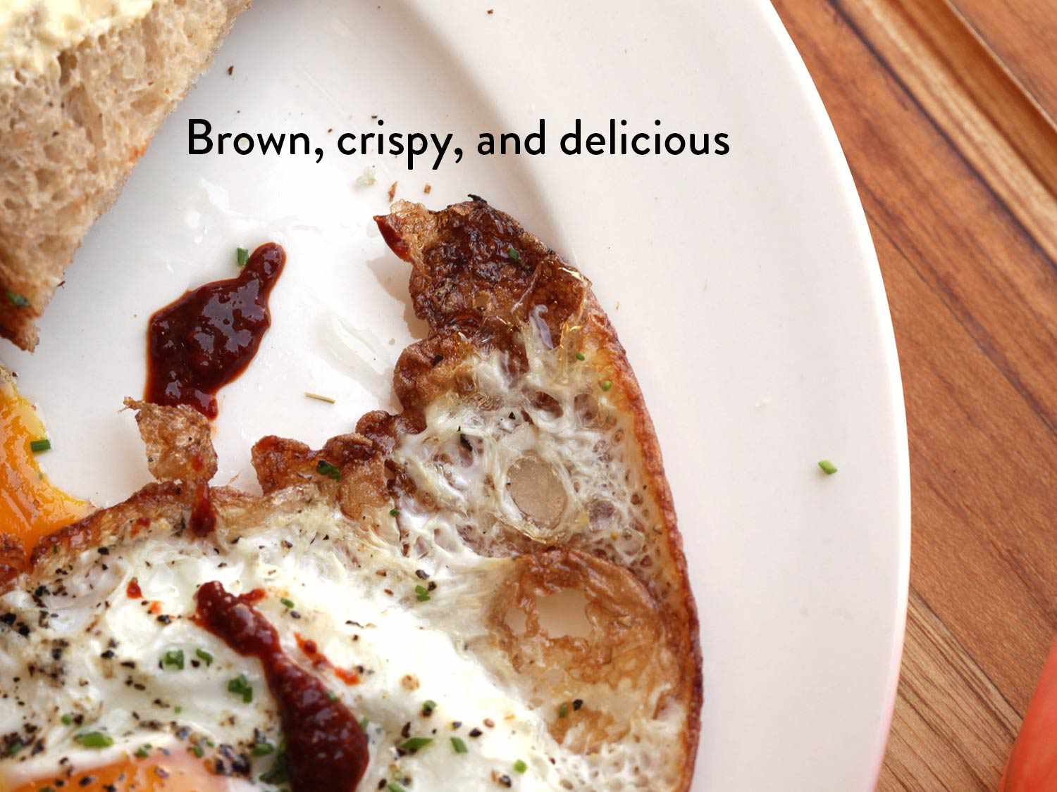 Brown crispy edges of fried egg.