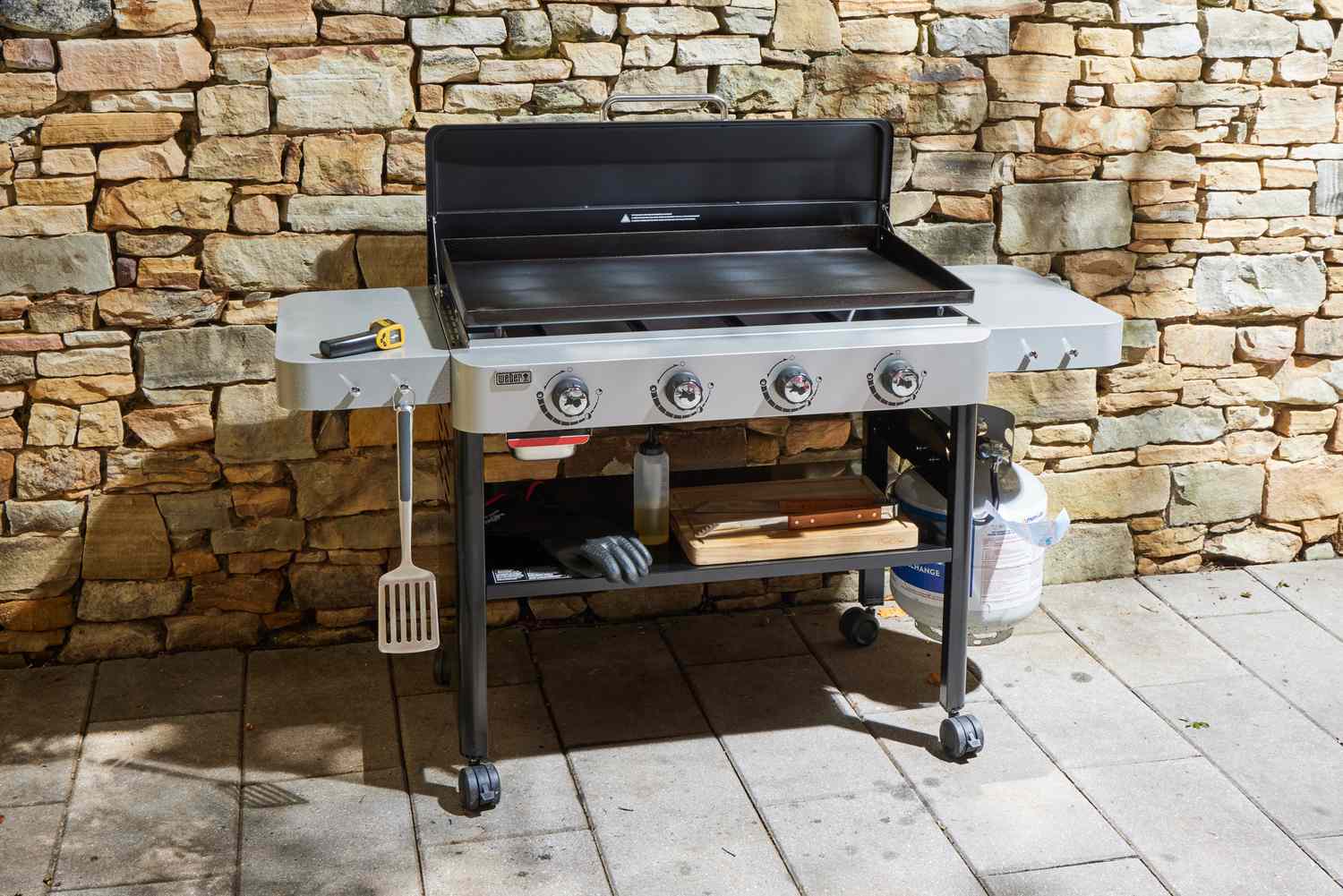 The Weber 36 Inch Gas Griddle outside on a patio