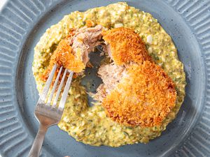 Cutting into pork croquette