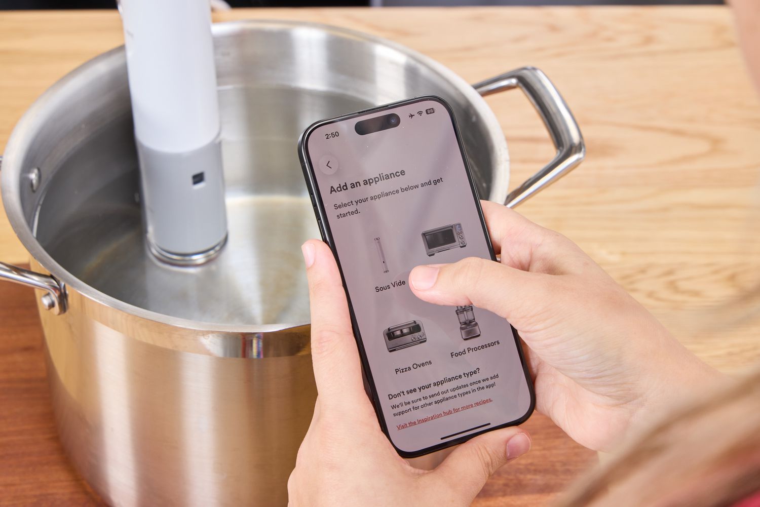 A person controls the Breville Joule Turbo Sous Vide using their smartphone