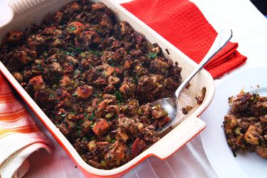 A red dish of vegan Thanksgiving stuffing.