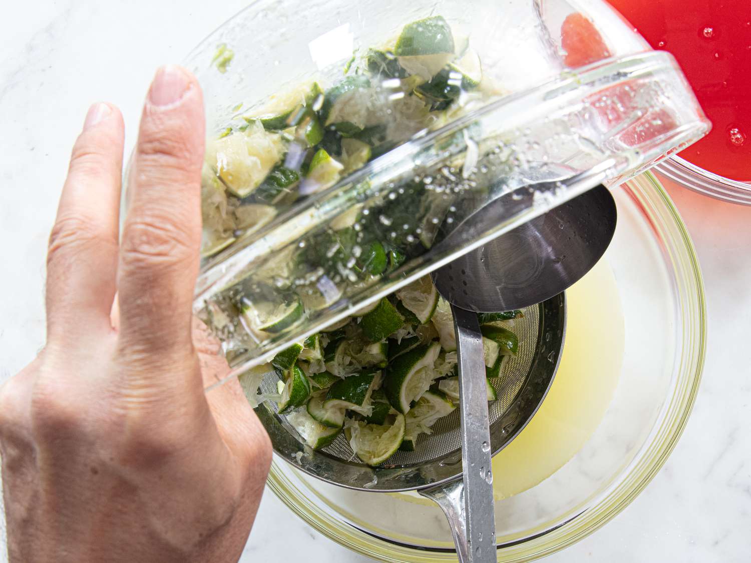 Overhead view of straining limeade