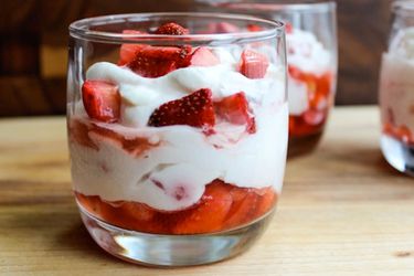 Profile view of individual strawberry fools, served in highball glasses.