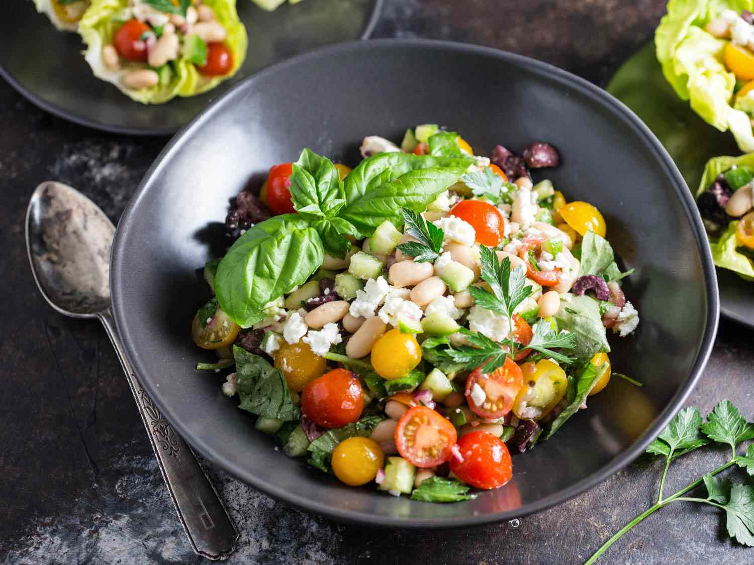 Closeup of the prepared white bean salad in a bowl, ready to be spooned into lettuce cups.