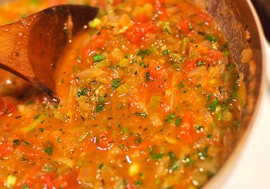 Close up view of Creole sauce in a saucepan. 