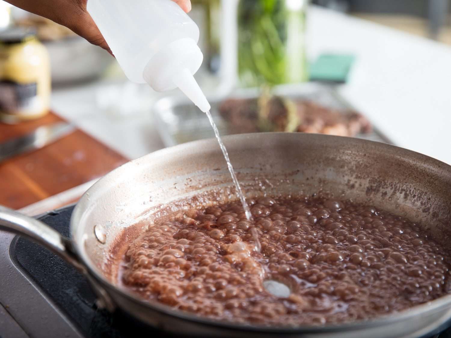 Adding water from a squeeze bottle to fix a broken pan sauce