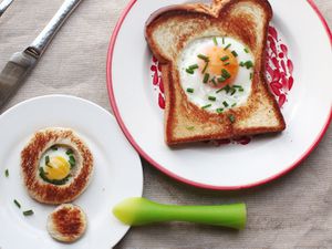 A full-size and tiny version of egg-in-a-hole plated side by side