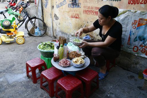 A vendor selling pho in Hanoi