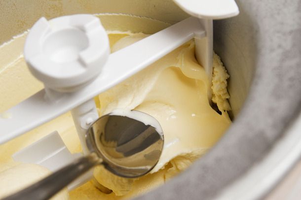 The finished frozen custard is scooped up with a spoon.