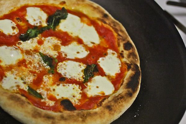 A Neapolitan style pizza made at home with charred and blistered crust. 