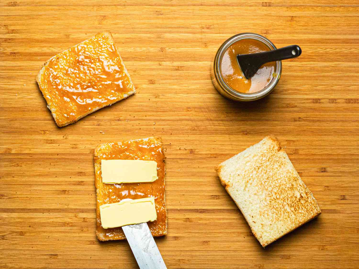 Overhead view of putting butter on kaya bread