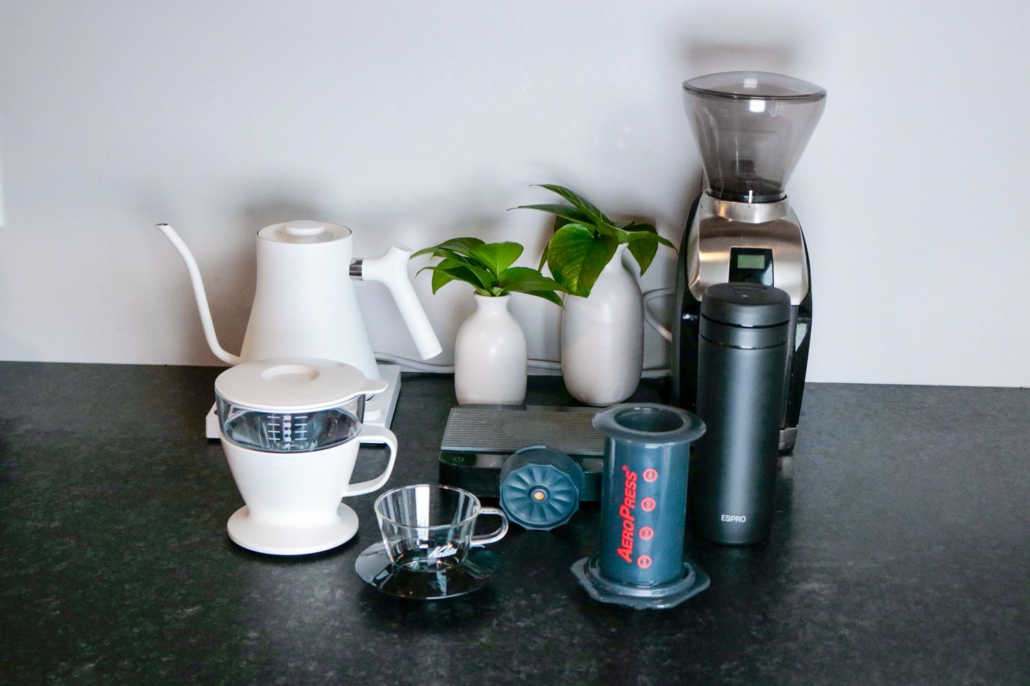 multiple single-serve coffee brewer on a grey surface