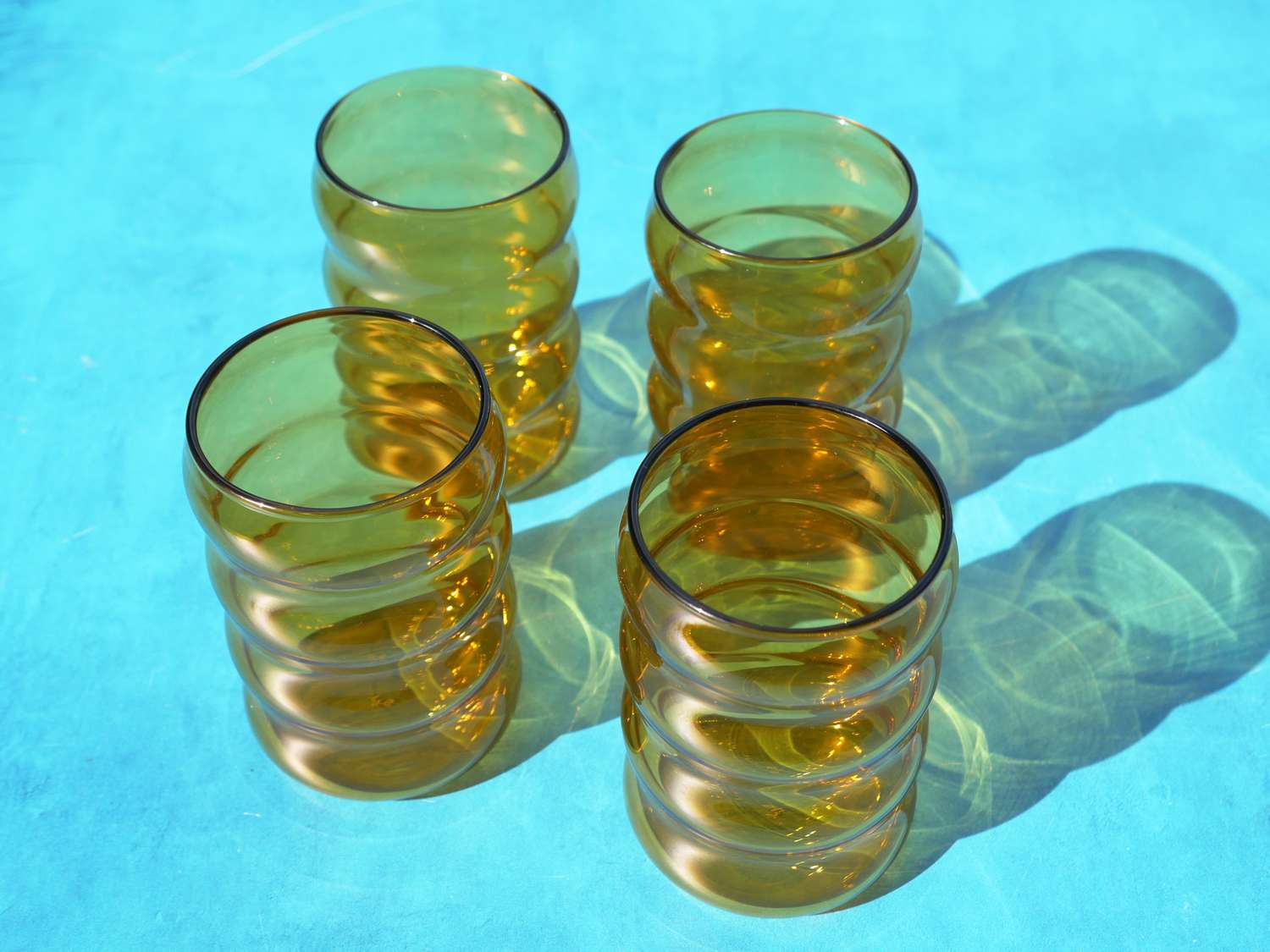 sophie lou jacobson glasses on a blue surface