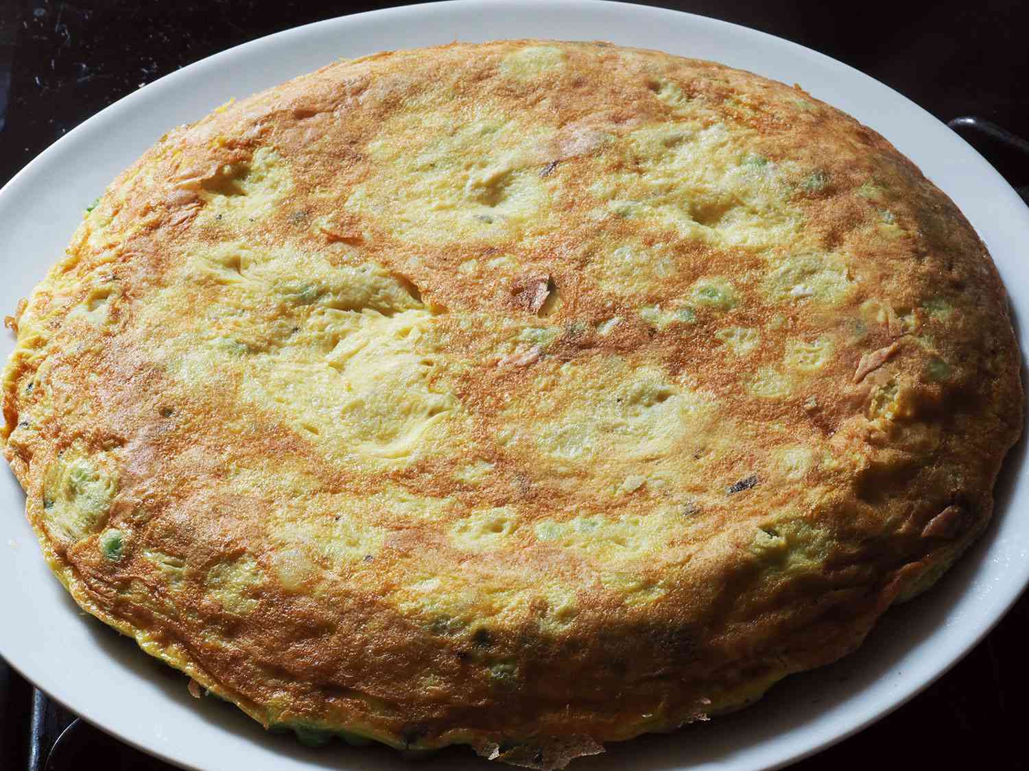 The finished frittata, turned out onto a plate.