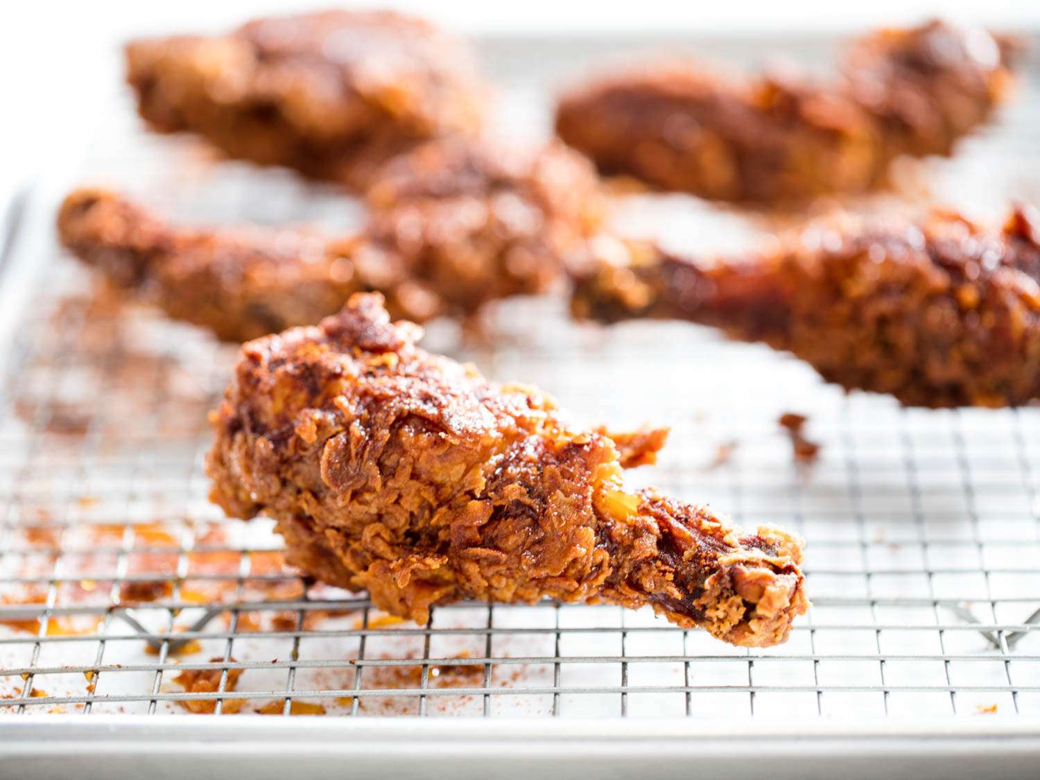 fried chicken on rimmed baking sheet with rack