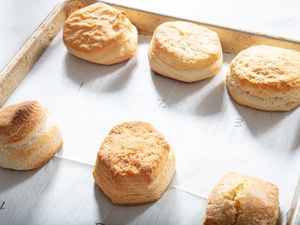 Six baked biscuits arranged on a parchmentlined baking sheet labeled with numbers