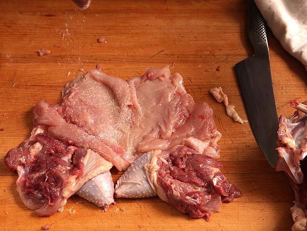 Deboned, butterflied chicken seasoned with salt and pepper