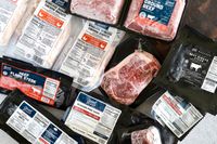 A selection of Good Chop meat products including beef pork and chicken with visible nutrition labels