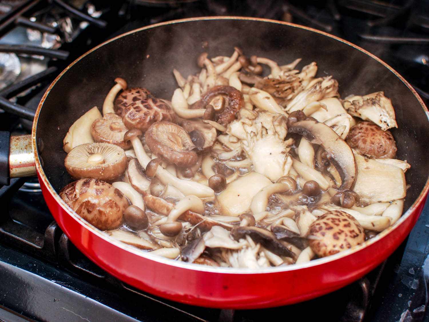 cooking assorted fresh mushrooms in skillet