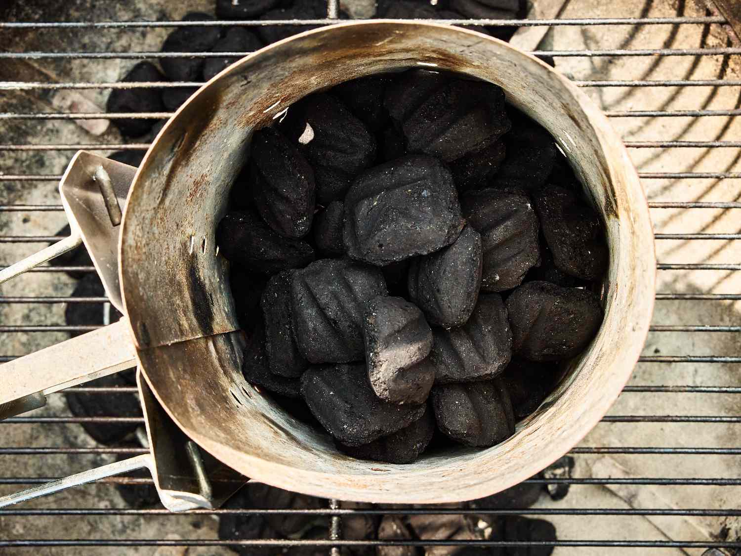 charcoal heating on an outdoor grill 