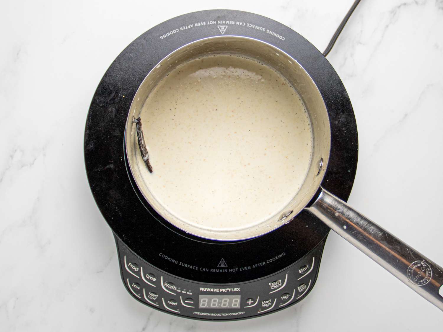 A pot of liquid on an induction stovetop