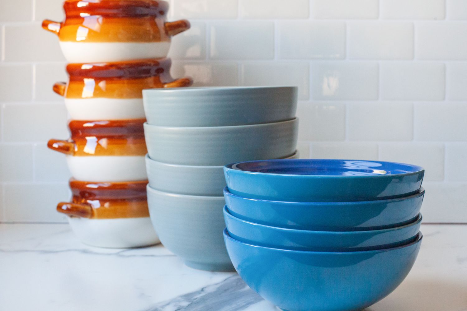 Three sets of stacked soup bowls