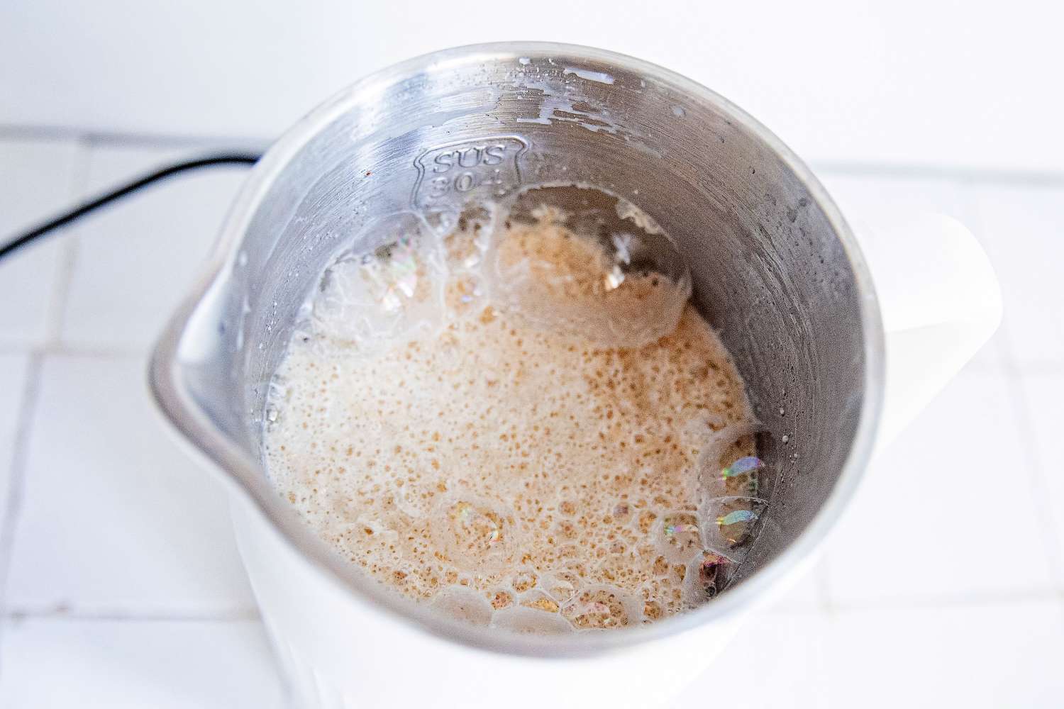 blended nuts and milk in the alfabot