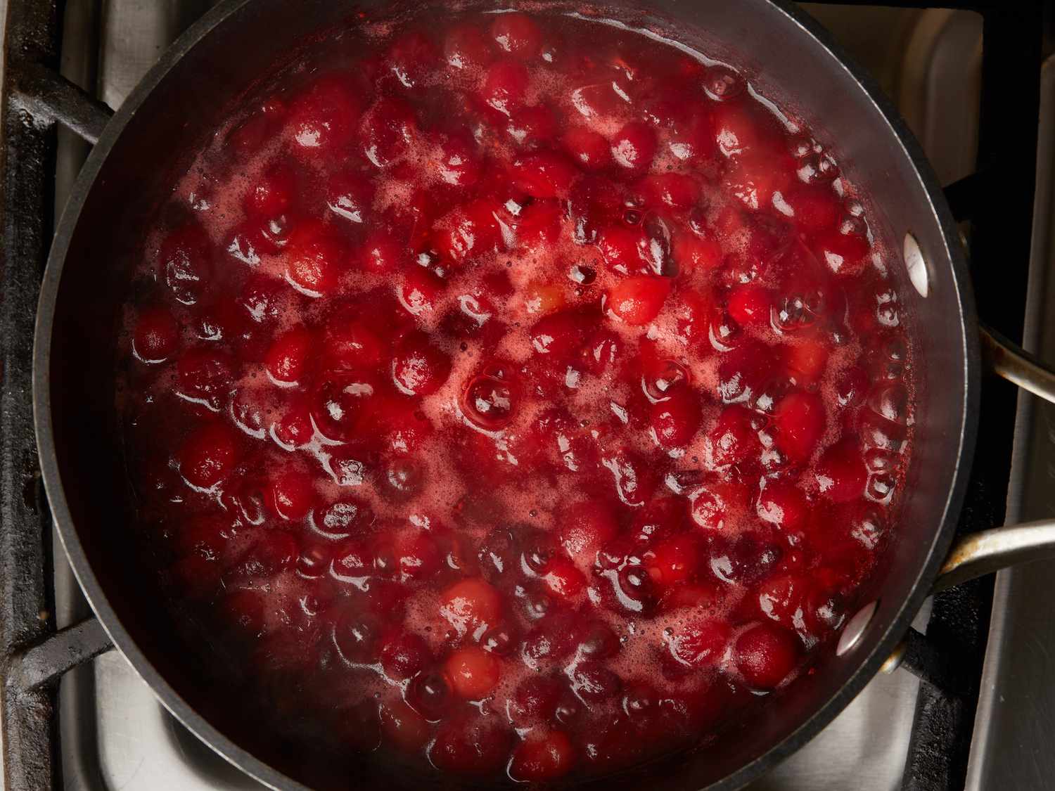 large saucepan with cooked and reduced cranberries