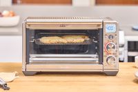 Chicken is cooked inside the Breville The Smart Oven Air Fryer Compact