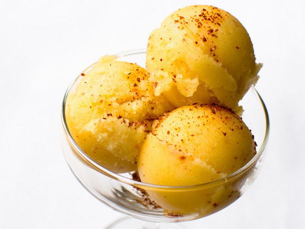 A triple scoop of pineapple and tequila sorbet, served in a margarita glass and sprinkled with Aleppo pepper.