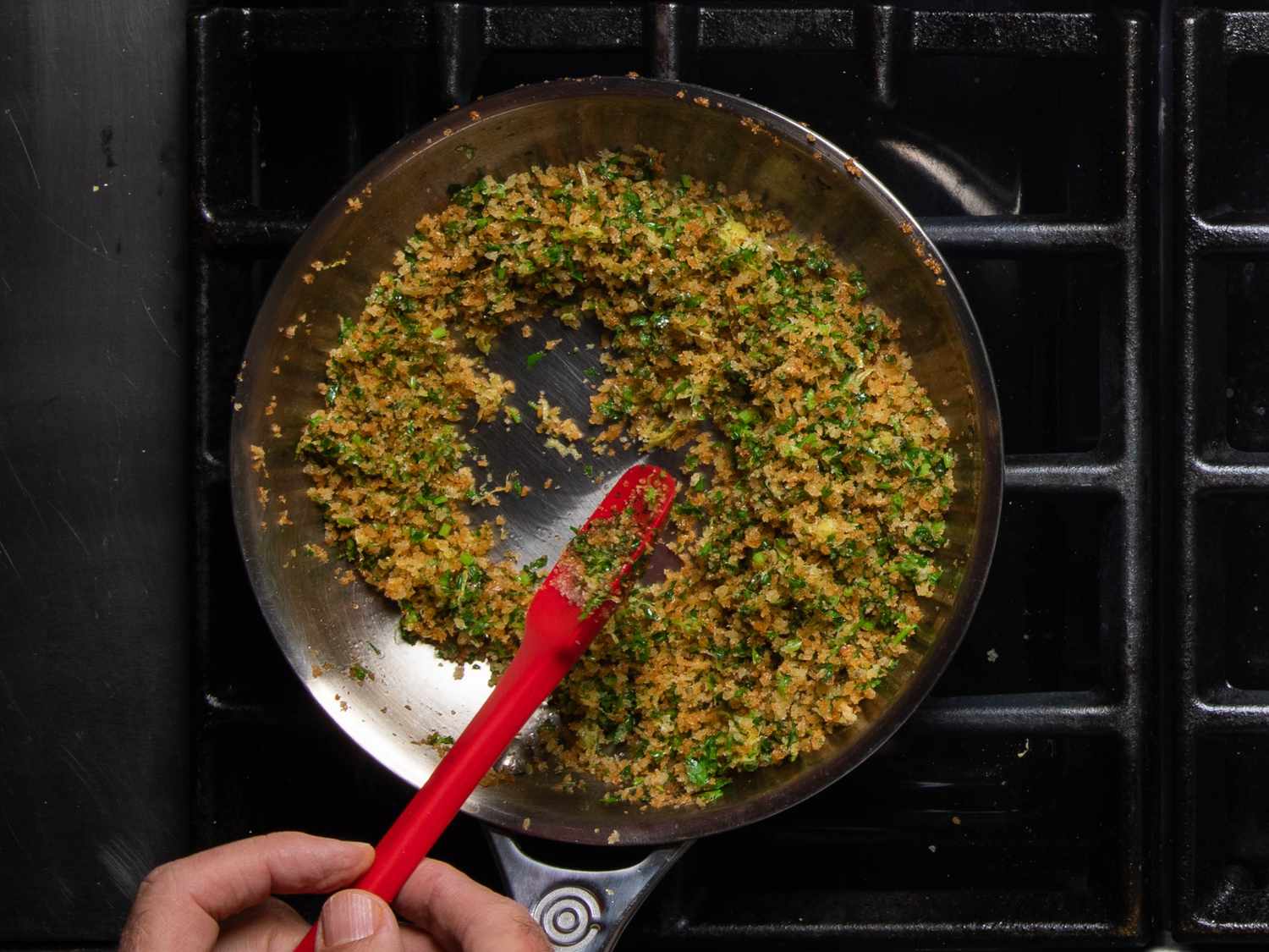 The seasoned, toasted breadcrumbs just after the parsley and lemon zest have been stirred in.