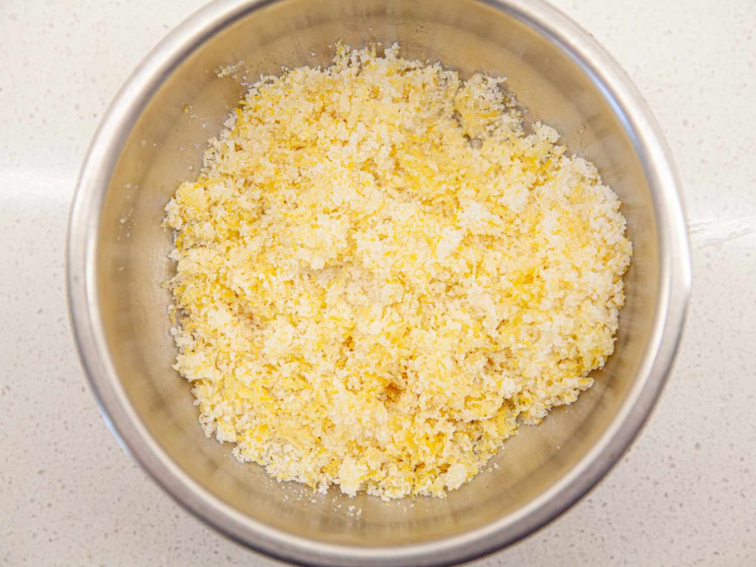 Overhead view of lemon and sugar in bowl