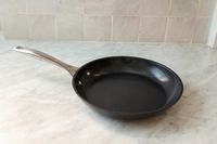The Le Creuset Ceramic Nonstick Frying Pan sitting on a kitchen counter