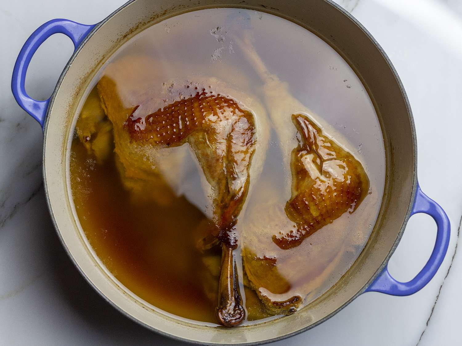 Turkey cooling turkey to room temperature in its cooking vessel while still submerged in fat.