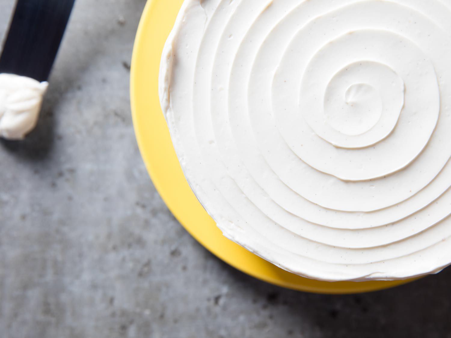 Top of layer cake swirled with Swiss meringue buttercream.