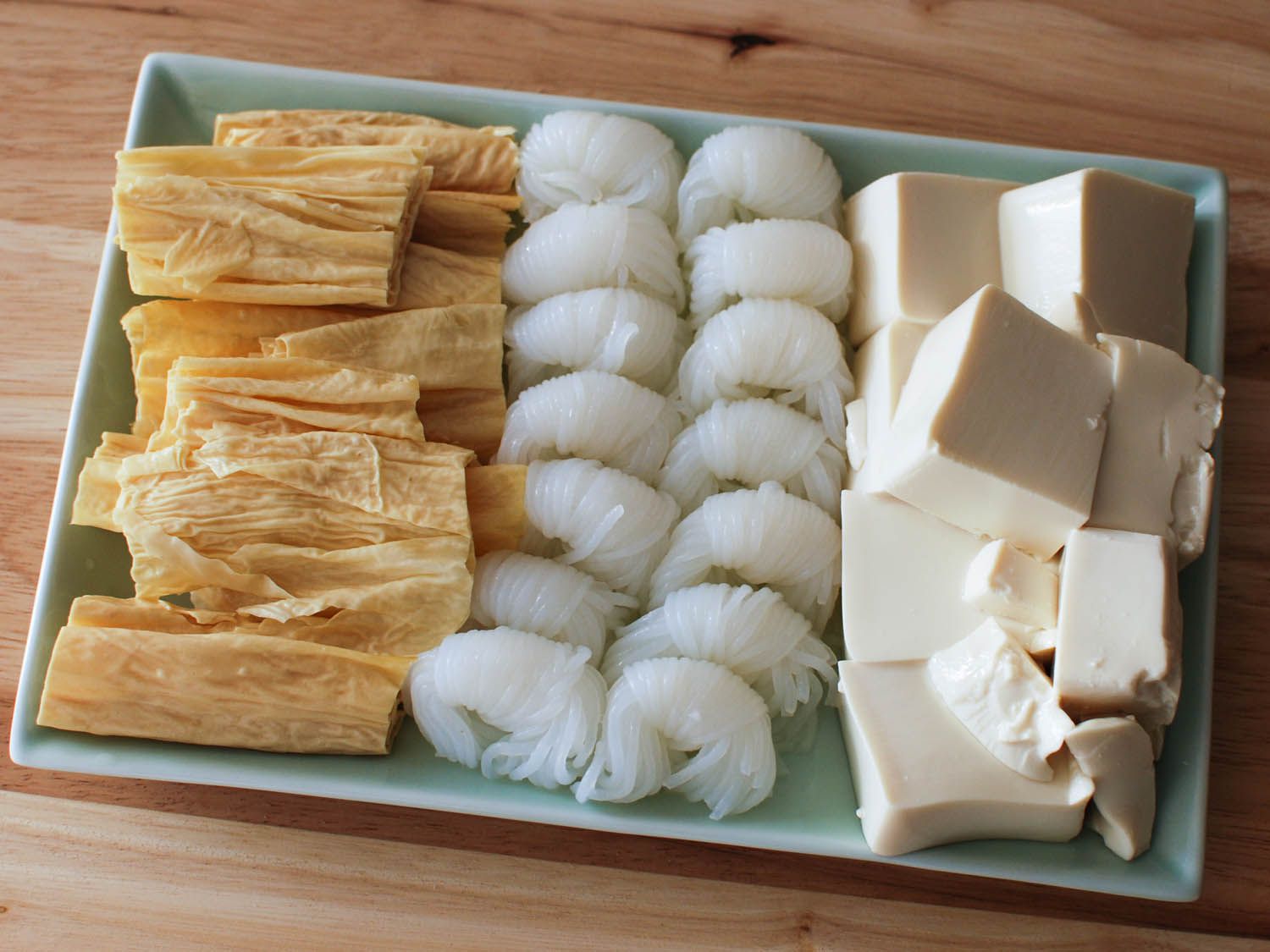 Tofu, noodles, and tofu skin for dipping in Chinese hot pot.