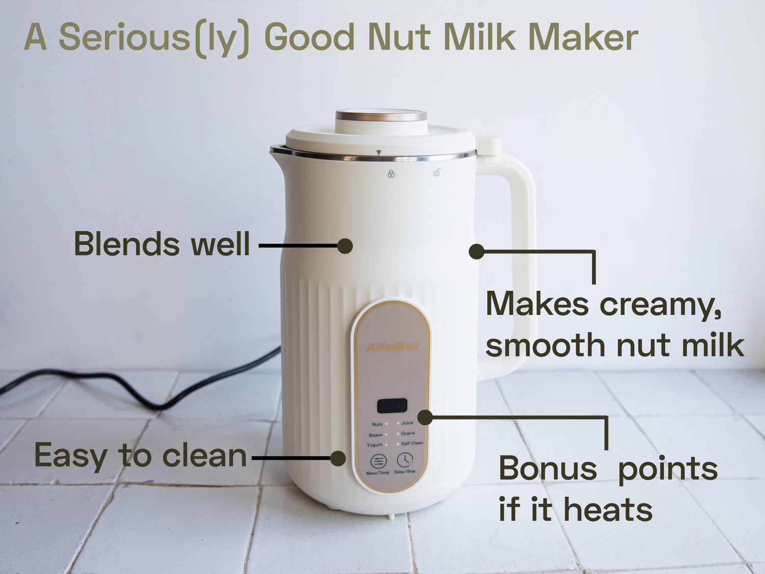 the alfabot nut milk maker on a white tile surface