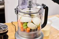 Vegetables in the KitchenAid 13-Cup Food Processor before chopping