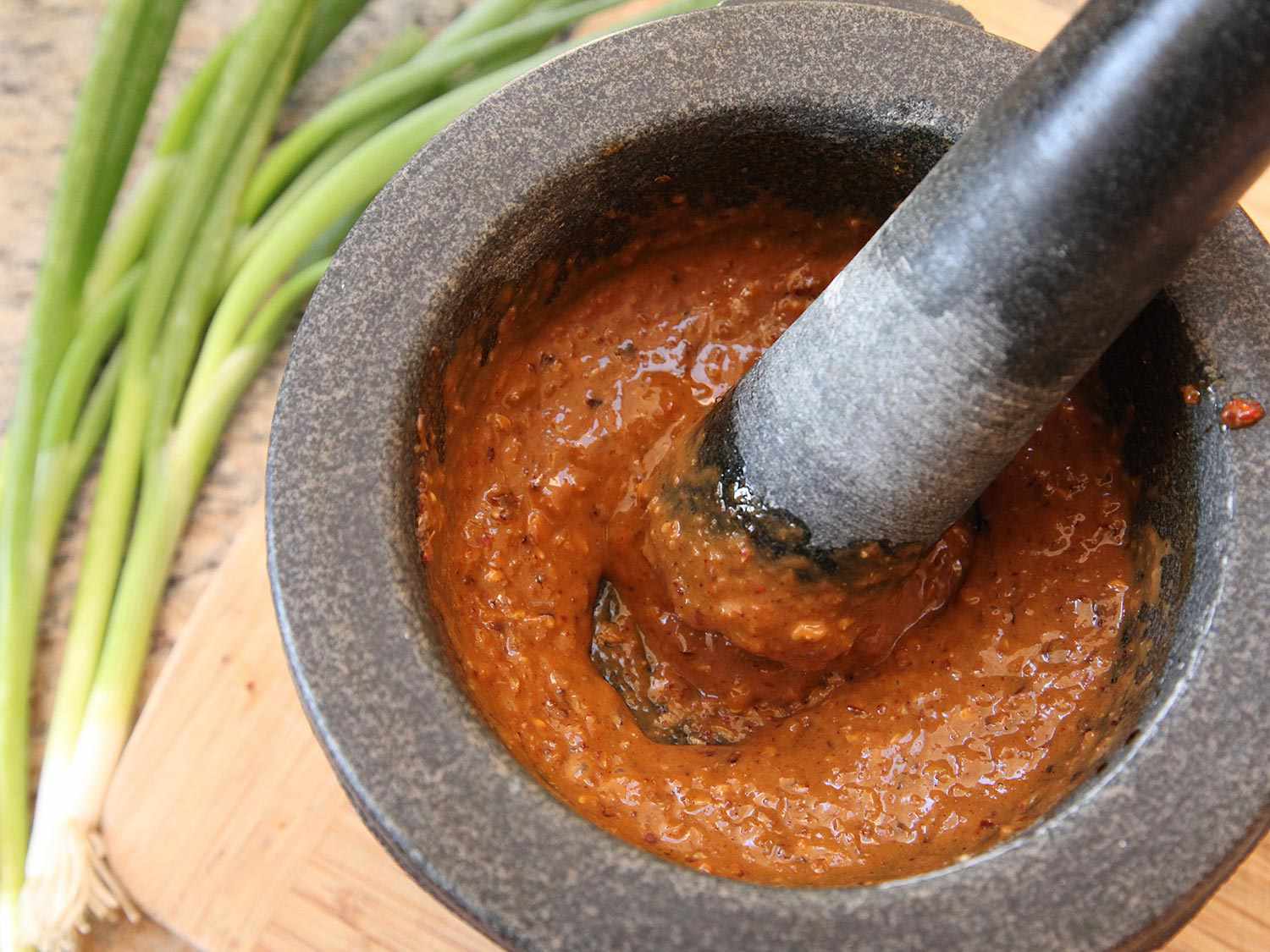 Emulsified Sichuan chile dressing in a pestle.