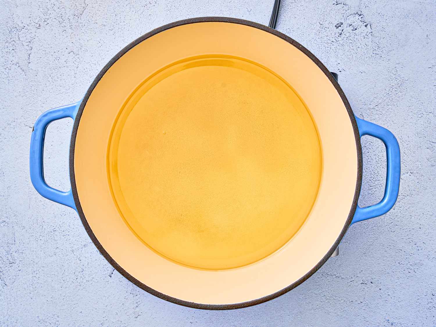 Overhead view of oil in dutch oven