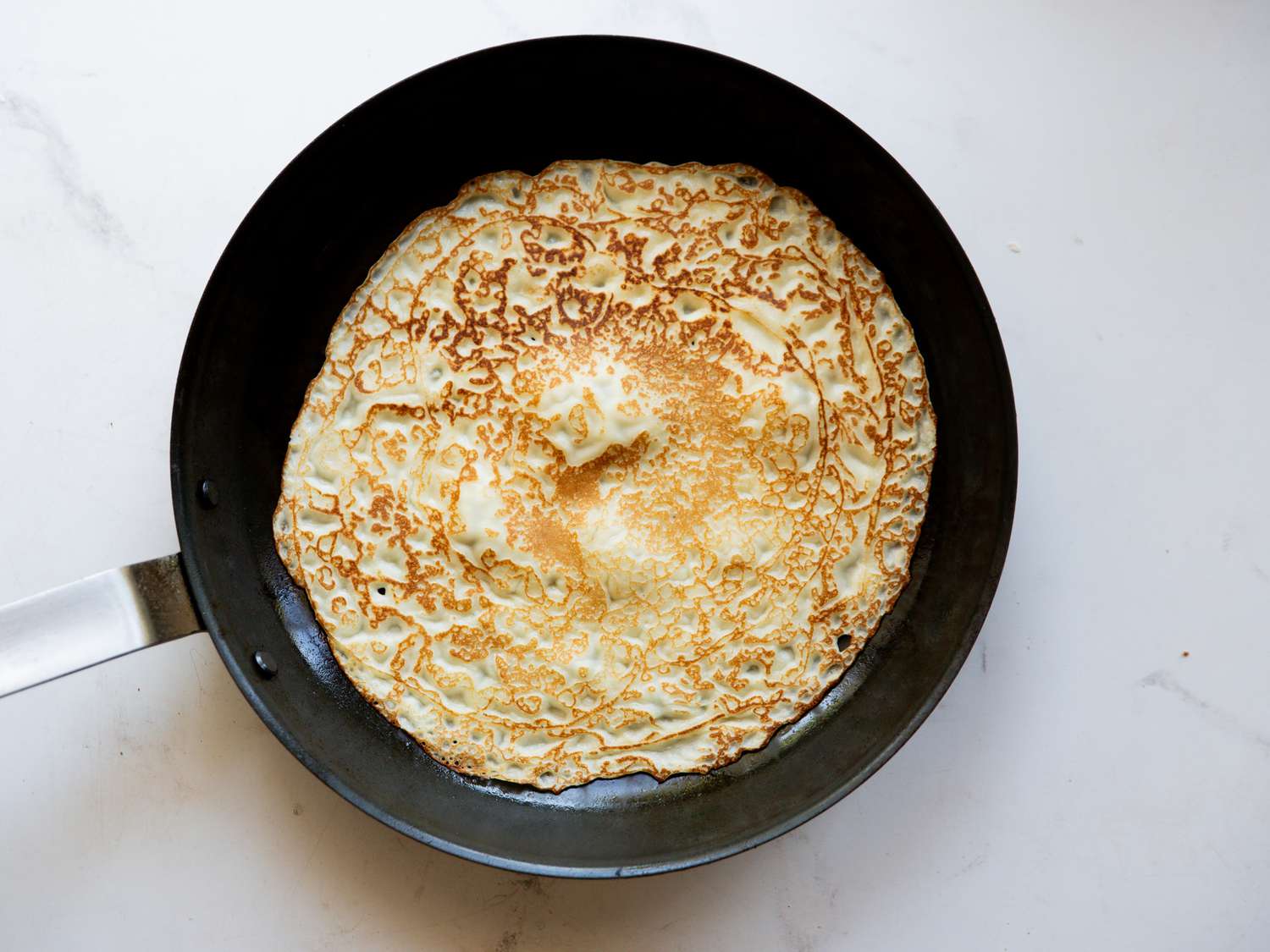 misen carbon steel pan with crepe