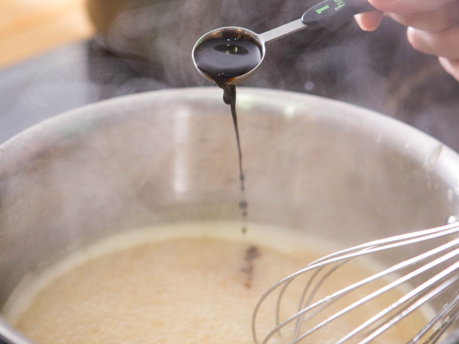 Adding a teaspoon of soy sauce to Swedish meatball gravy.